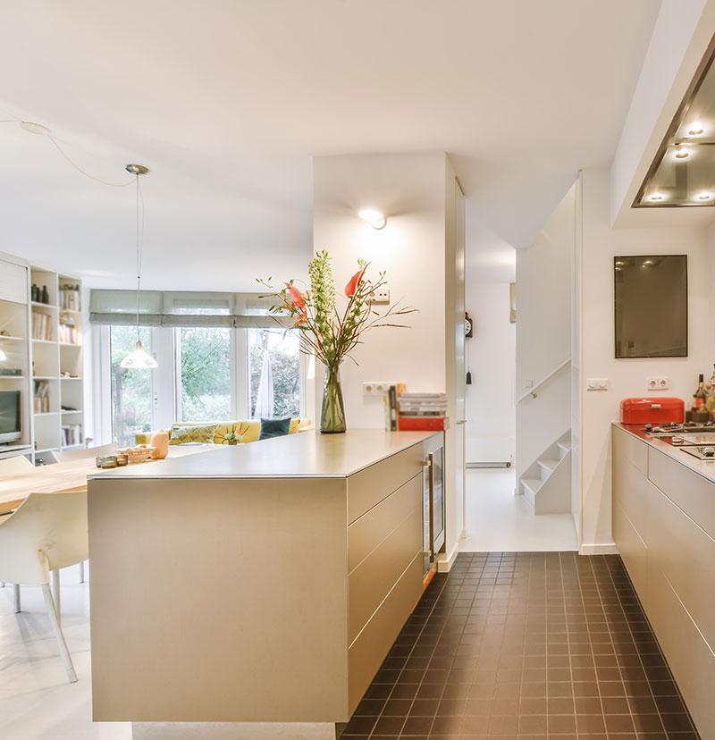 Full home renovation with open plan kitchen and media wall opening onto garden