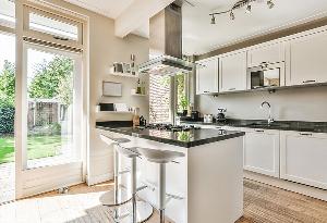open plan kitchen with traditional cupboards 